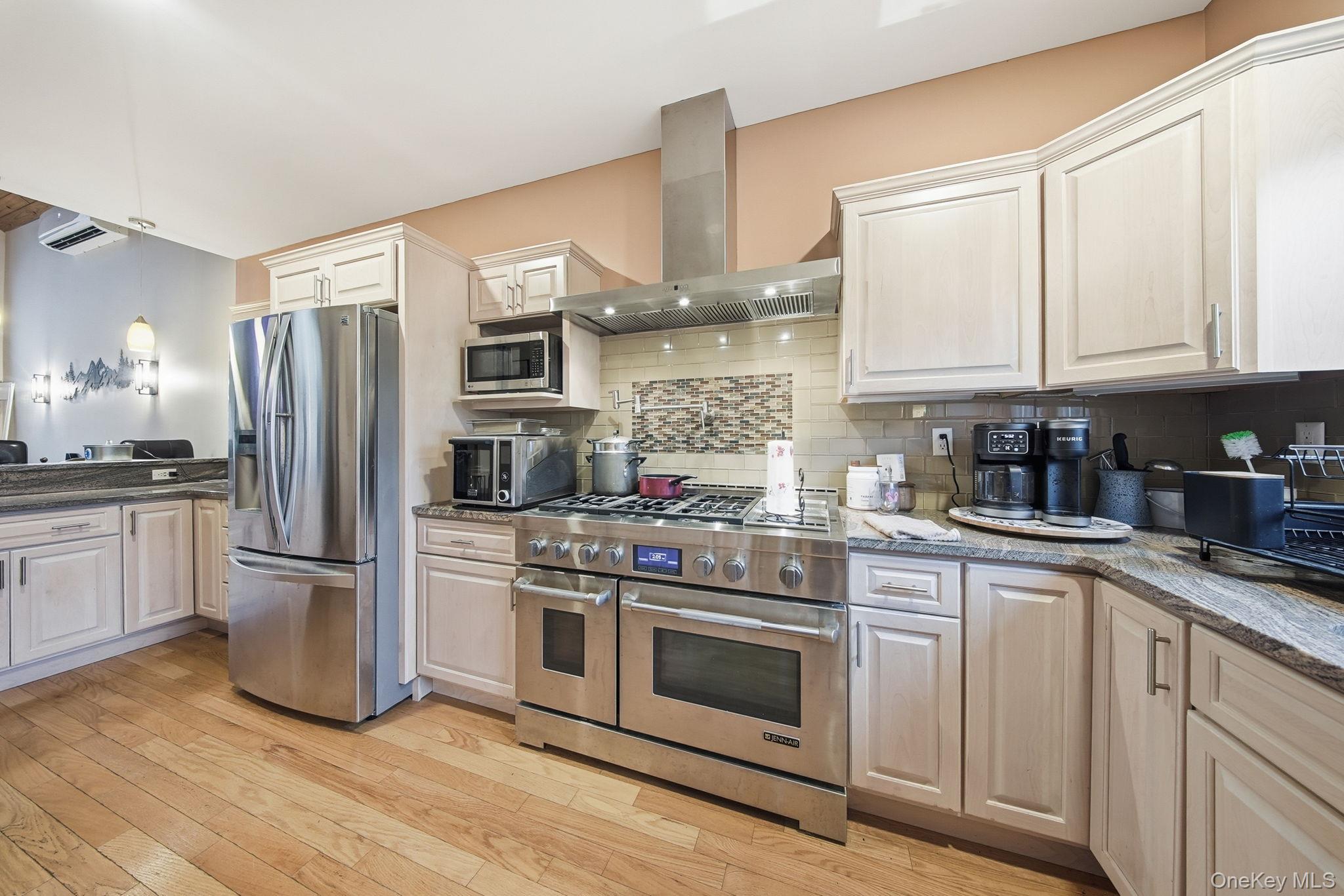 191 David Rhodes Road Wurtsboro, NY 12790 - Photo 9 of 39 a kitchen with stainless steel appliances granite countertop a refrigerator stove and sink