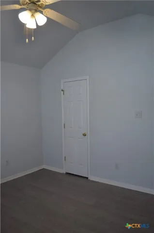a view of an empty room with a fan