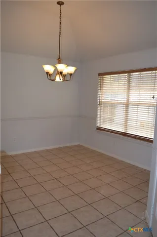 a kitchen with a sink appliances and cabinets