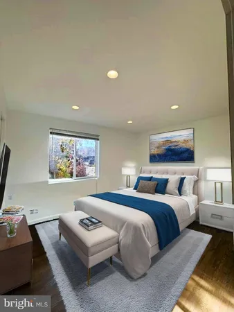 a bedroom with a bed and a couch