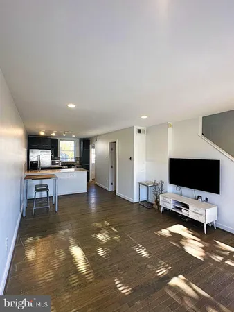 a view of a living room and dining room