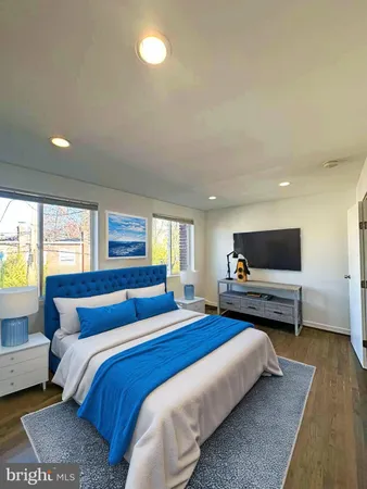 a bedroom with a bed and a couch