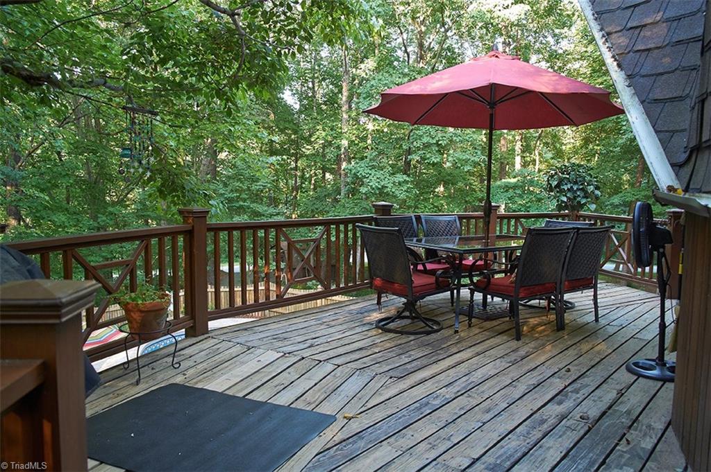 5205 Rambling Road Greensboro, NC 27409 - Photo 11 of 30 Spacious deck overlooking a beautiful fenced pool & hot tub! How relaxing!