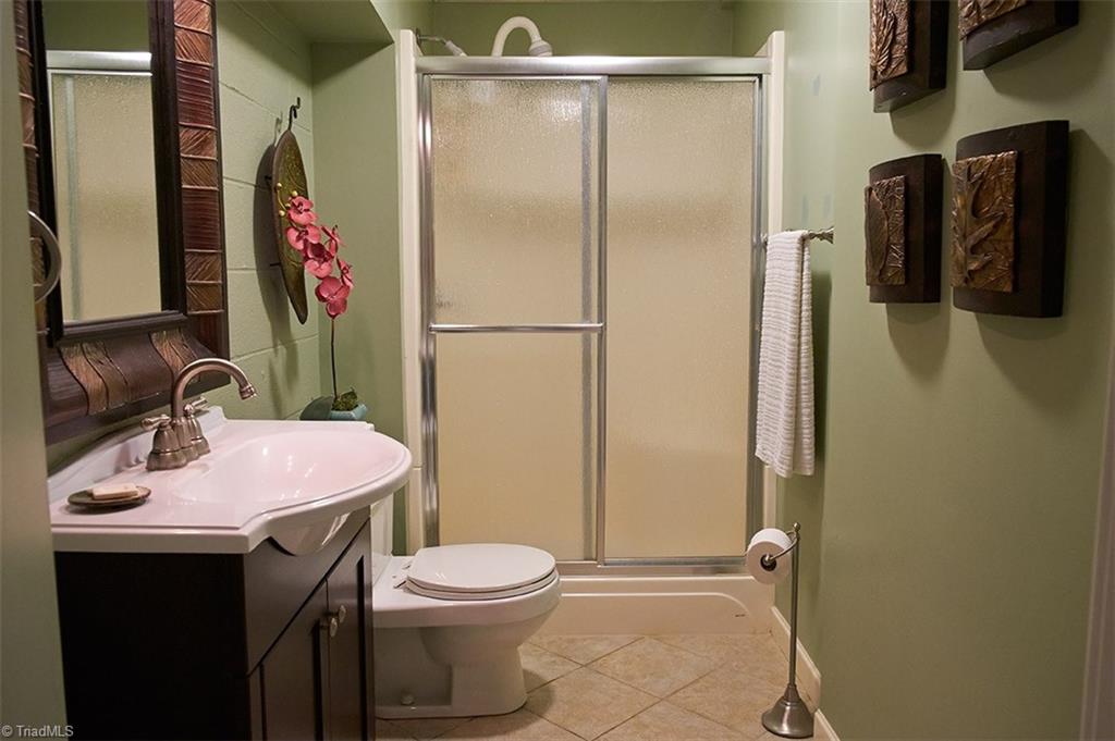 5205 Rambling Road Greensboro, NC 27409 - Photo 27 of 30 Full updated bathroom in the finished basement.