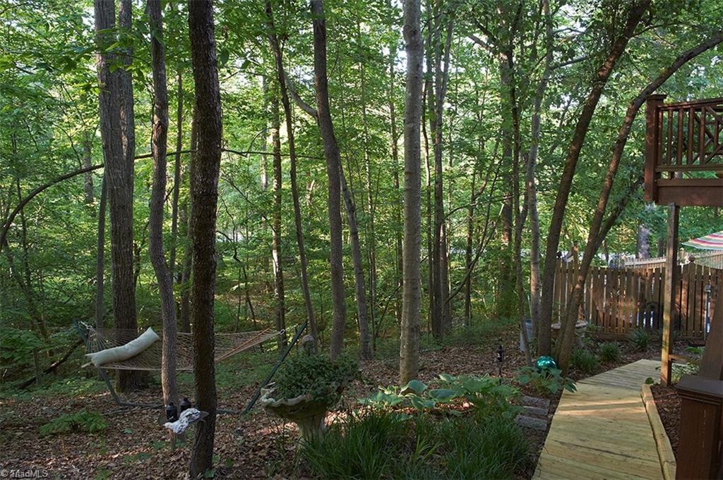 5205 Rambling Road Greensboro, NC 27409 - Photo 28 of 30 Relax in your own hammock in the middle of your 1.46 wooded acres!