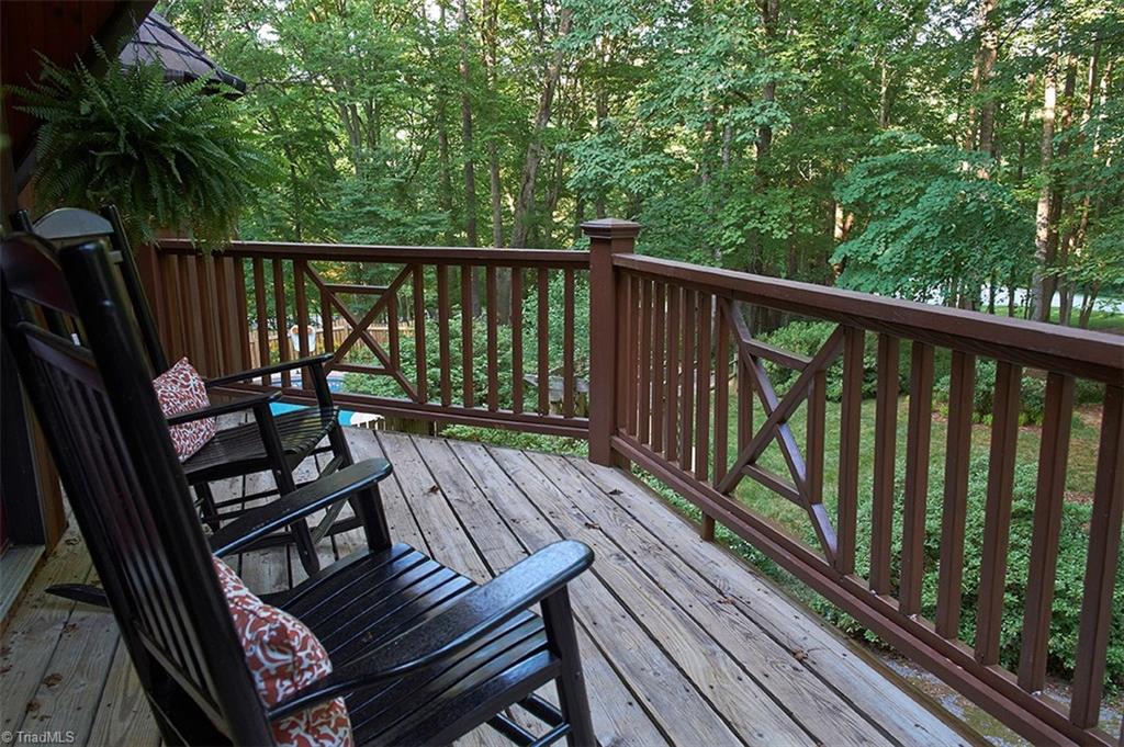 5205 Rambling Road Greensboro, NC 27409 - Photo 5 of 30 Enjoy your morning coffee, or relax in the evening on this cozy deck with a view of the pool!