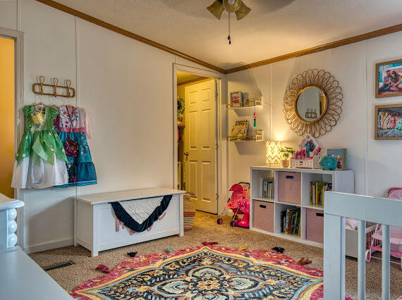 6341 Farm Private Road Levelland, TX 79336 - Photo 23 of 46 a very nice looking room with a big bed