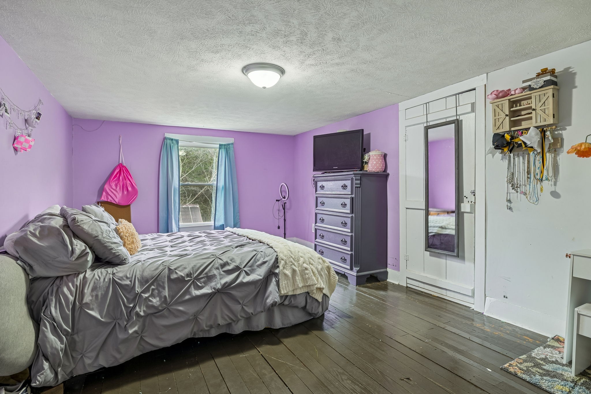 147 Sloan Branch Road Pleasant Shade, TN 37145 - Photo 33 of 53 a bedroom with a bed and a dresser