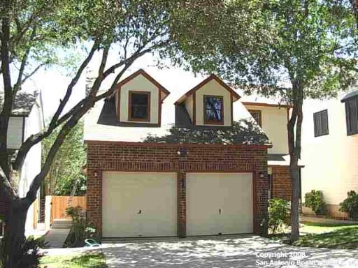 16618 Spruce Tree Lane San Antonio, TX 78247 - Photo 1 of 1 a house that has a tree in front of it