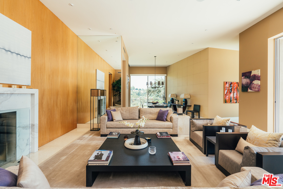 1470 Carla Ridge Beverly Hills, CA 90210 - Photo 4 of 44 a living room with furniture and a fireplace