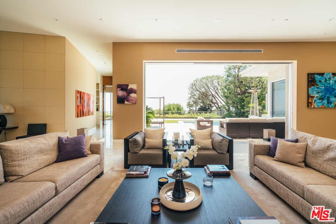 1470 Carla Ridge Beverly Hills, CA 90210 - Photo 7 of 44 a living room with furniture and a large window