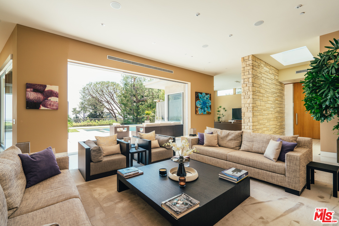 1470 Carla Ridge Beverly Hills, CA 90210 - Photo 8 of 44 a living room with furniture and a large window