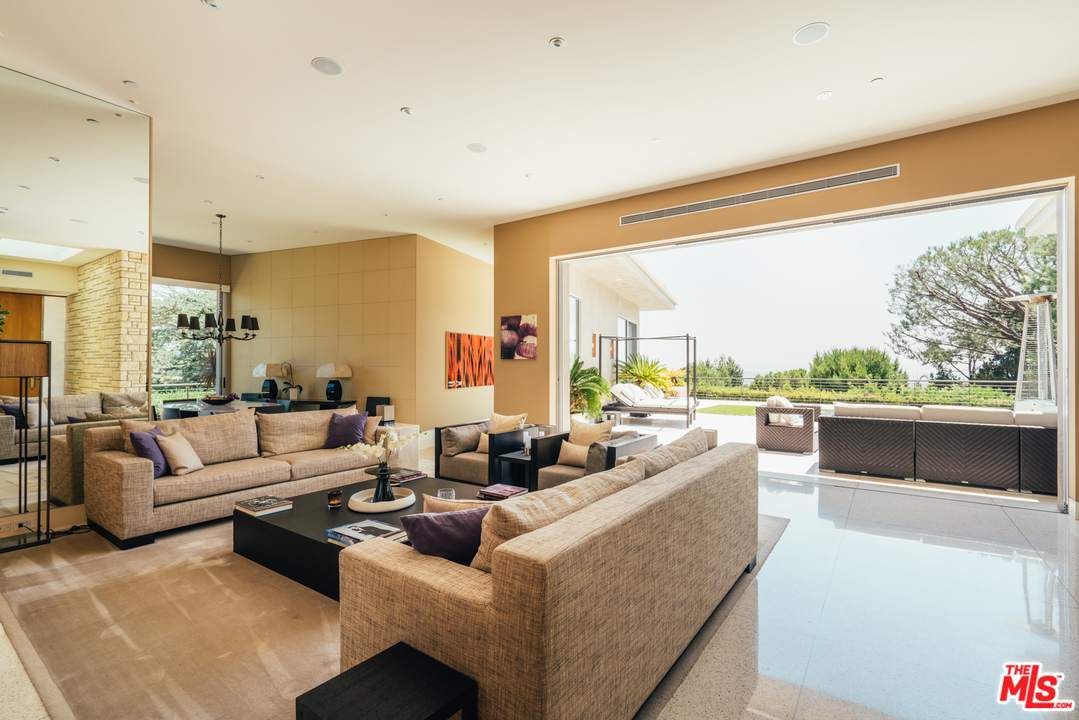 1470 Carla Ridge Beverly Hills, CA 90210 - Photo 9 of 44 a living room with furniture and a large window