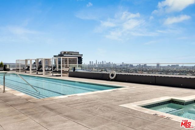 a view of swimming pool with a yard