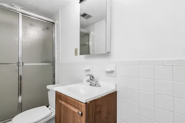 a bathroom with a sink toilet and vanity