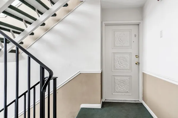 a view of entryway with wooden floor