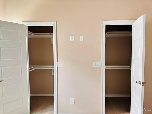 a view of an empty walk in closet