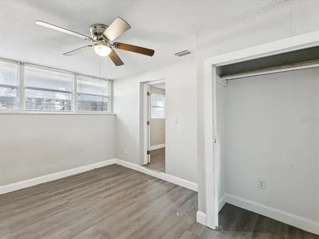 a view of an entryway with wooden floor