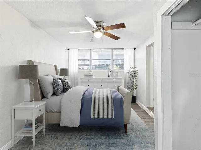 a bed room with a bed and a window