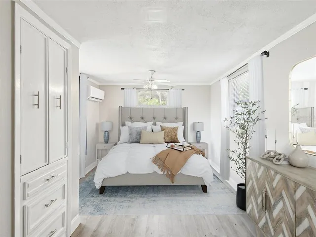 a bedroom with a bed and a table