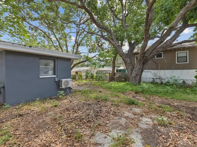 a backyard of a house with lots of green space