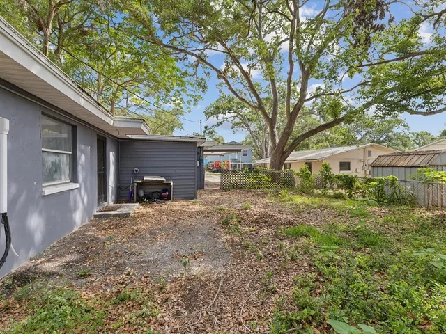 a view of house with yard and entertaining space