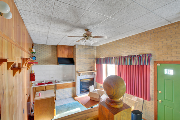 1067 West 97th Street Chicago, IL 60643 - Photo 13 of 15 a living room with furniture and a chandelier