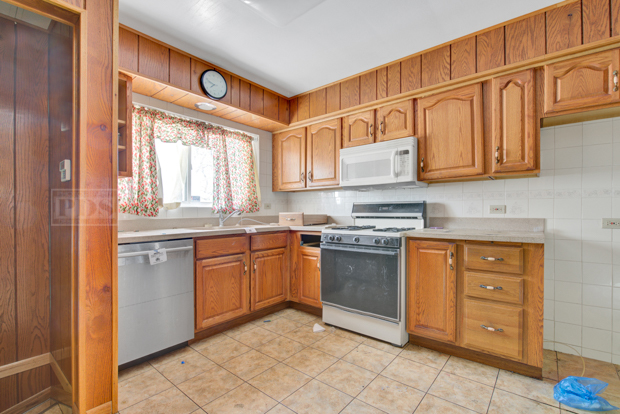 1067 West 97th Street Chicago, IL 60643 - Photo 8 of 15 a kitchen with stainless steel appliances granite countertop a stove and a refrigerator