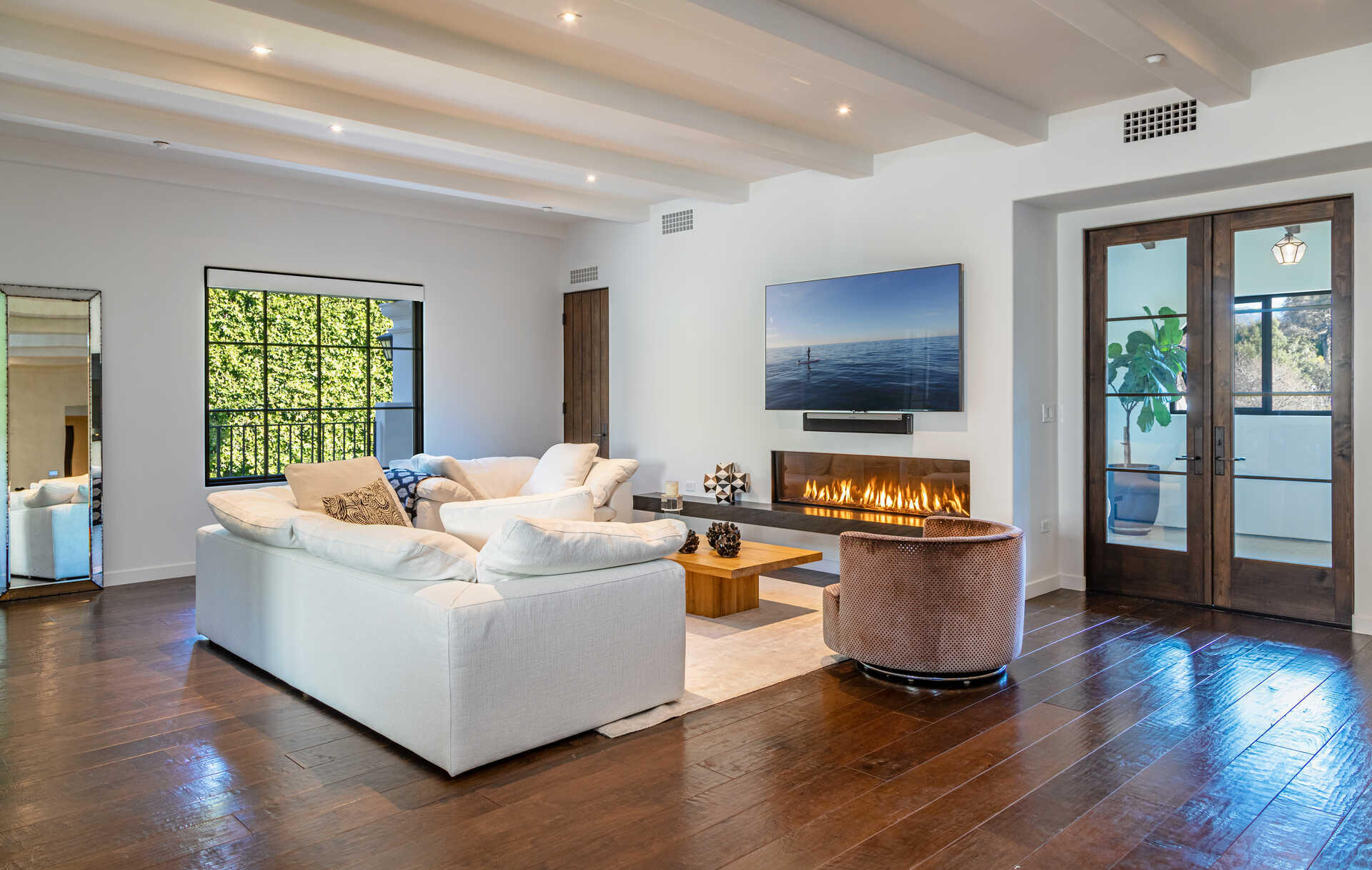107 Olive Mill Road Santa Barbara, CA 93108 - Photo 14 of 39 a living room with furniture and a flat screen tv