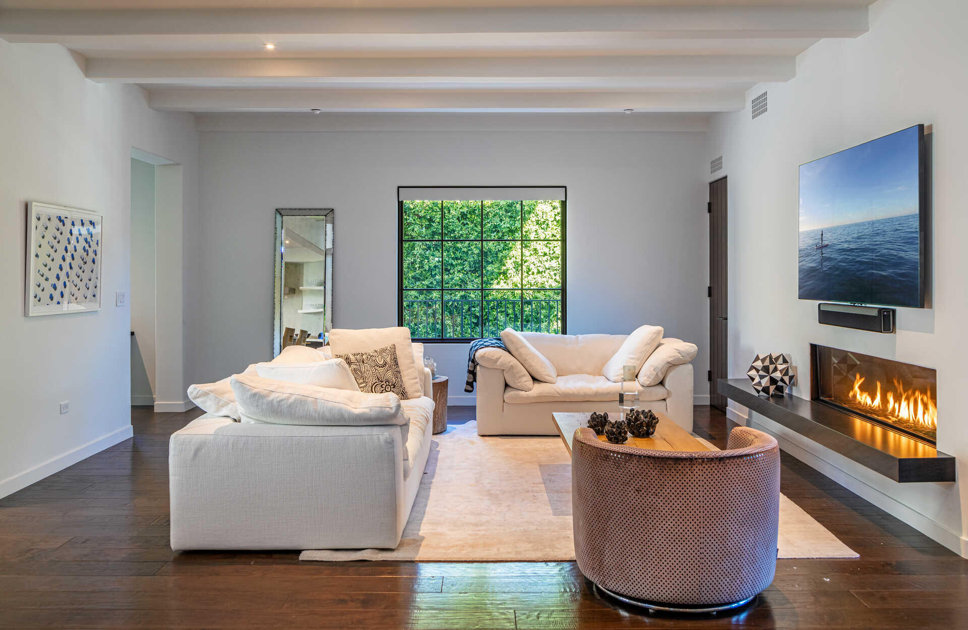 107 Olive Mill Road Santa Barbara, CA 93108 - Photo 15 of 39 a living room with furniture and a flat screen tv