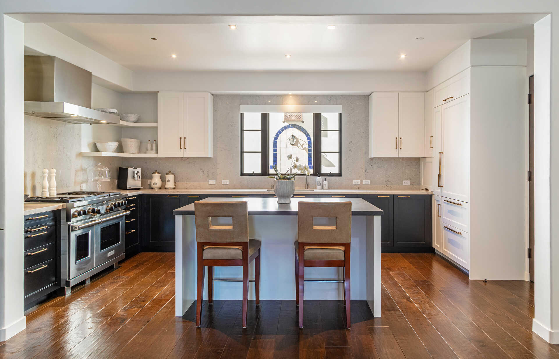107 Olive Mill Road Santa Barbara, CA 93108 - Photo 17 of 39 a kitchen with stainless steel appliances granite countertop a stove a sink dishwasher a microwave oven and a refrigerator with wooden floor