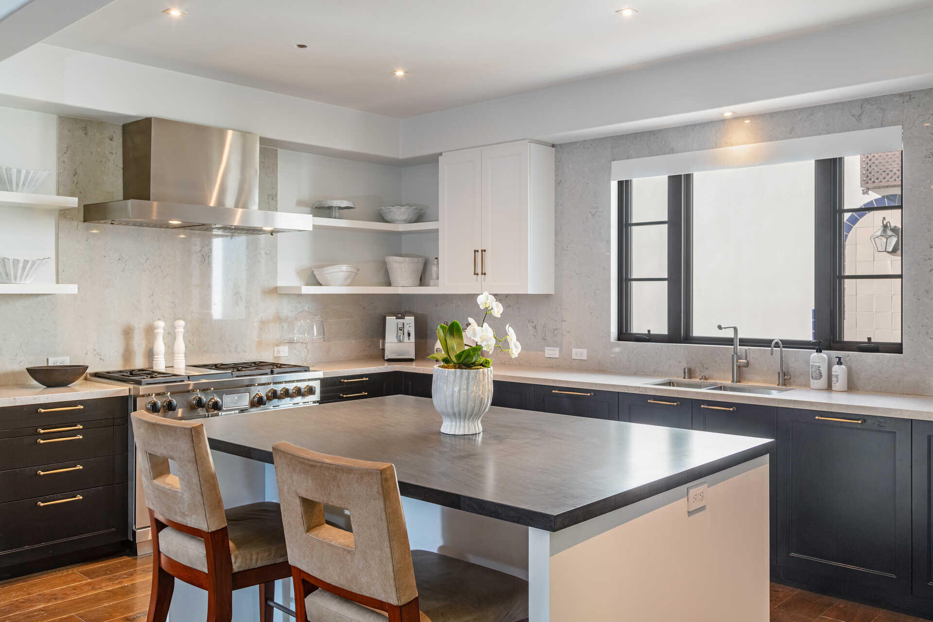 107 Olive Mill Road Santa Barbara, CA 93108 - Photo 18 of 39 a kitchen with a sink a stove and chairs