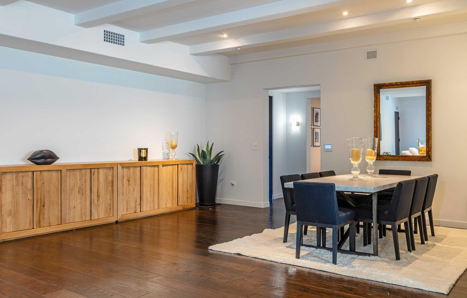 107 Olive Mill Road Santa Barbara, CA 93108 - Photo 22 of 39 a view of a dining room with furniture and wooden floor