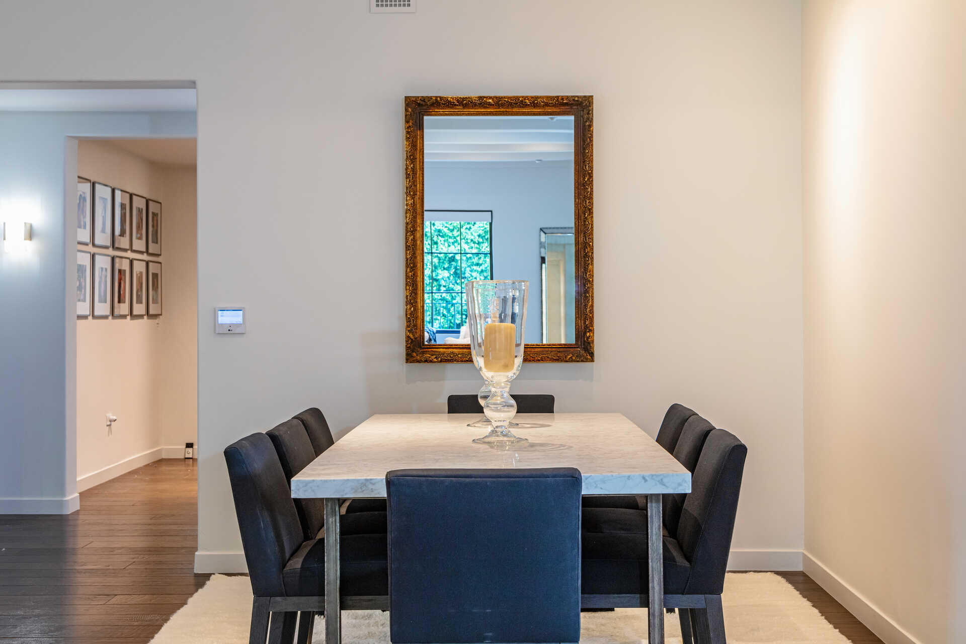 107 Olive Mill Road Santa Barbara, CA 93108 - Photo 23 of 39 a dining room with a table and chairs