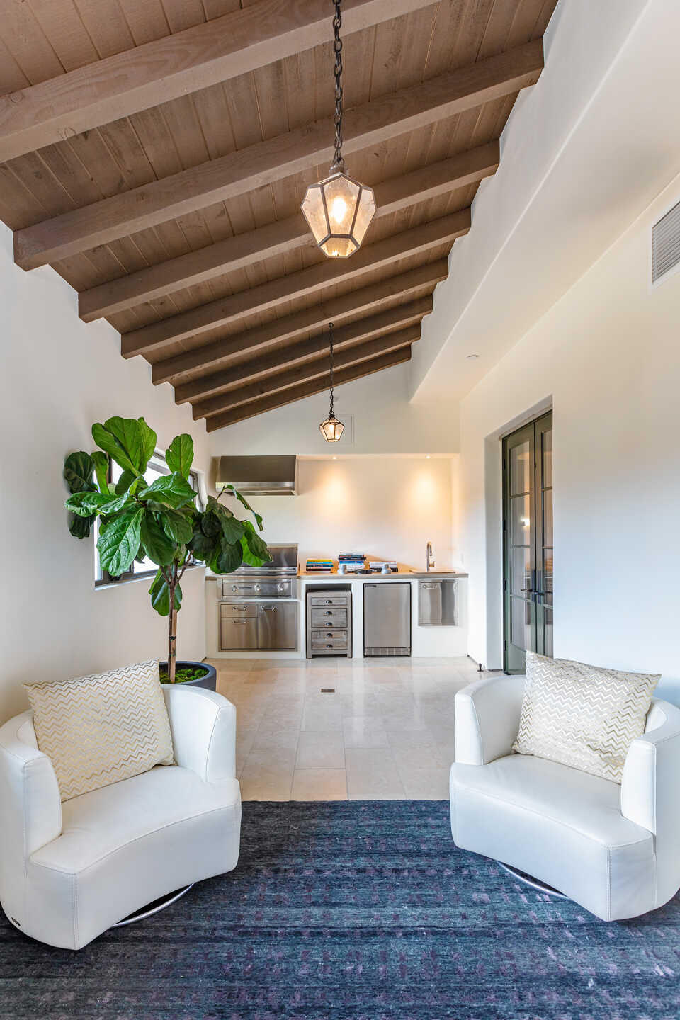 107 Olive Mill Road Santa Barbara, CA 93108 - Photo 27 of 39 a living room with furniture and a chandelier