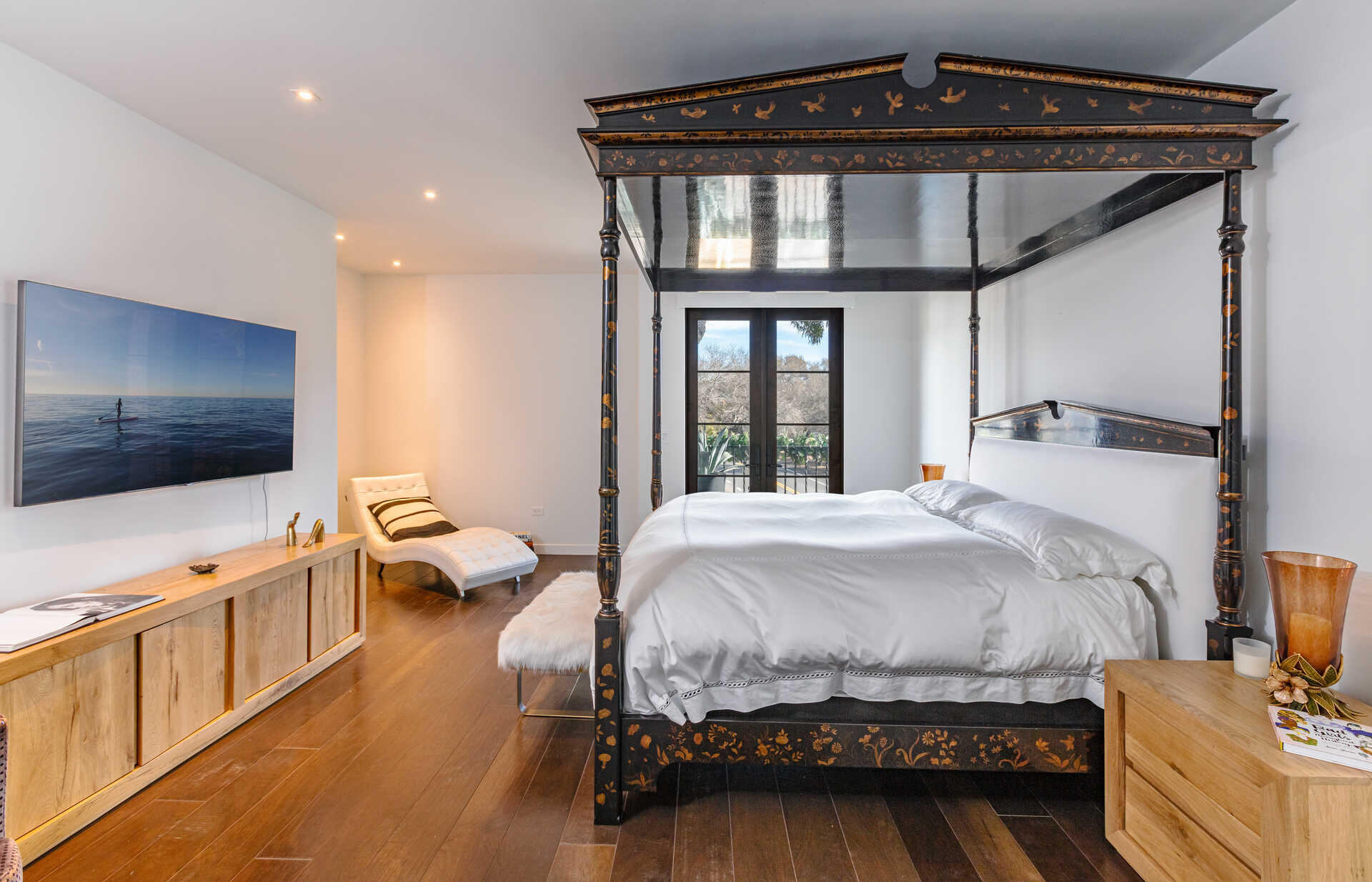 107 Olive Mill Road Santa Barbara, CA 93108 - Photo 30 of 39 a bedroom with a bed and a flat tv screen on wall