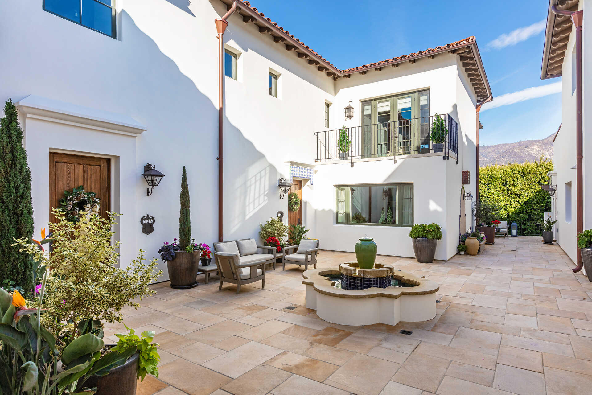 107 Olive Mill Road Santa Barbara, CA 93108 - Photo 9 of 39 a living room filled with furniture and a potted plant