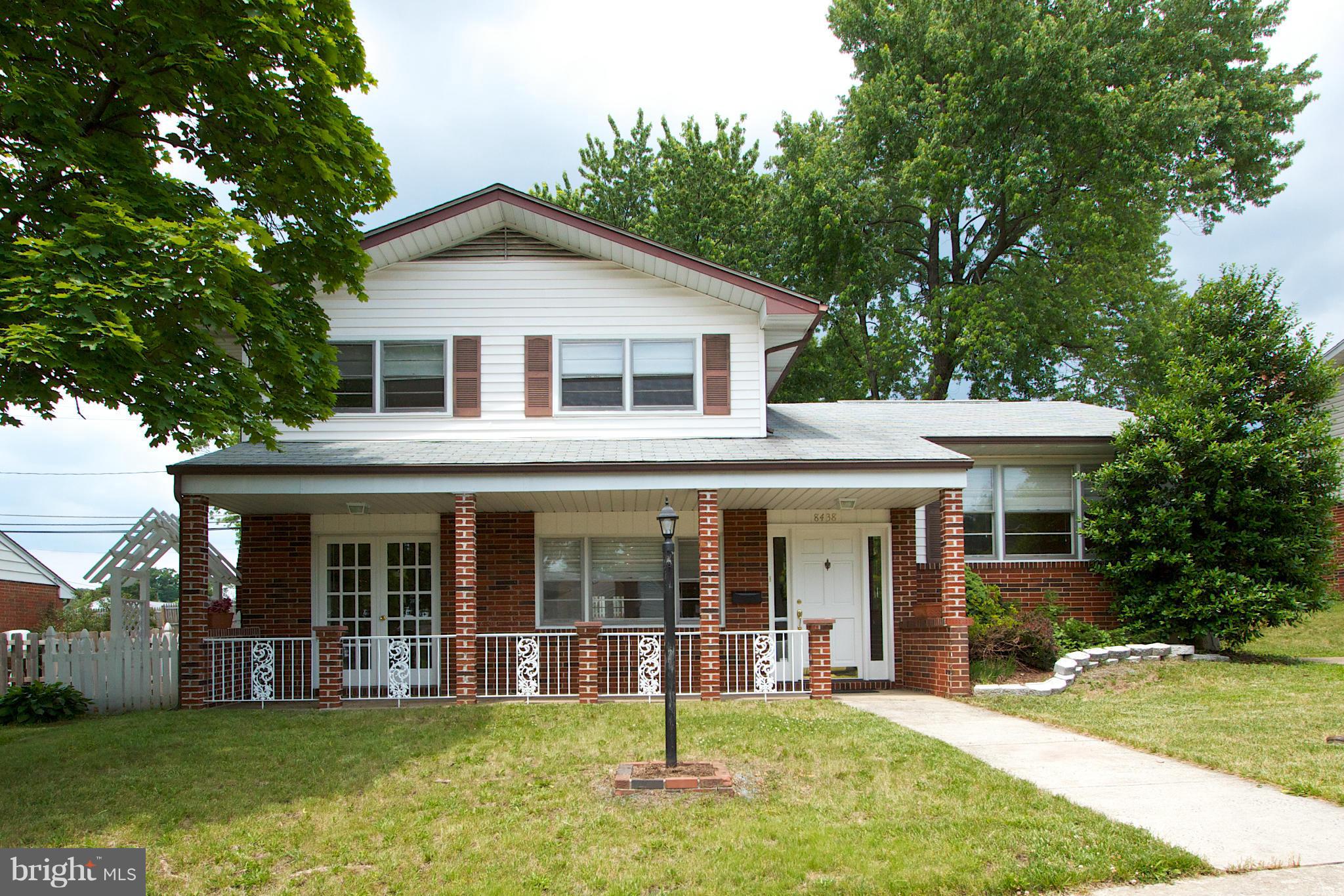 8438 Coco Road Baltimore, MD 21237 - Photo 1 of 29 a front view of a house with a yard