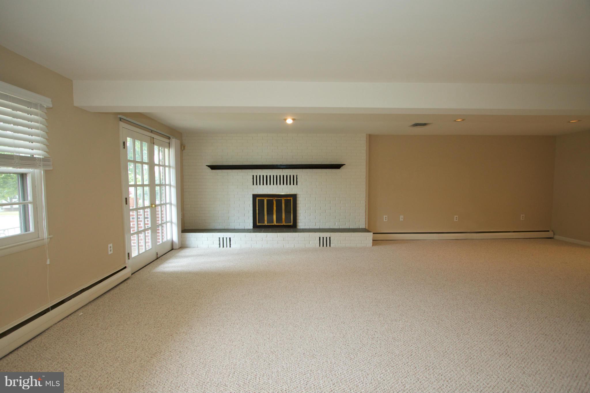 8438 Coco Road Baltimore, MD 21237 - Photo 2 of 29 an empty room with windows and closet