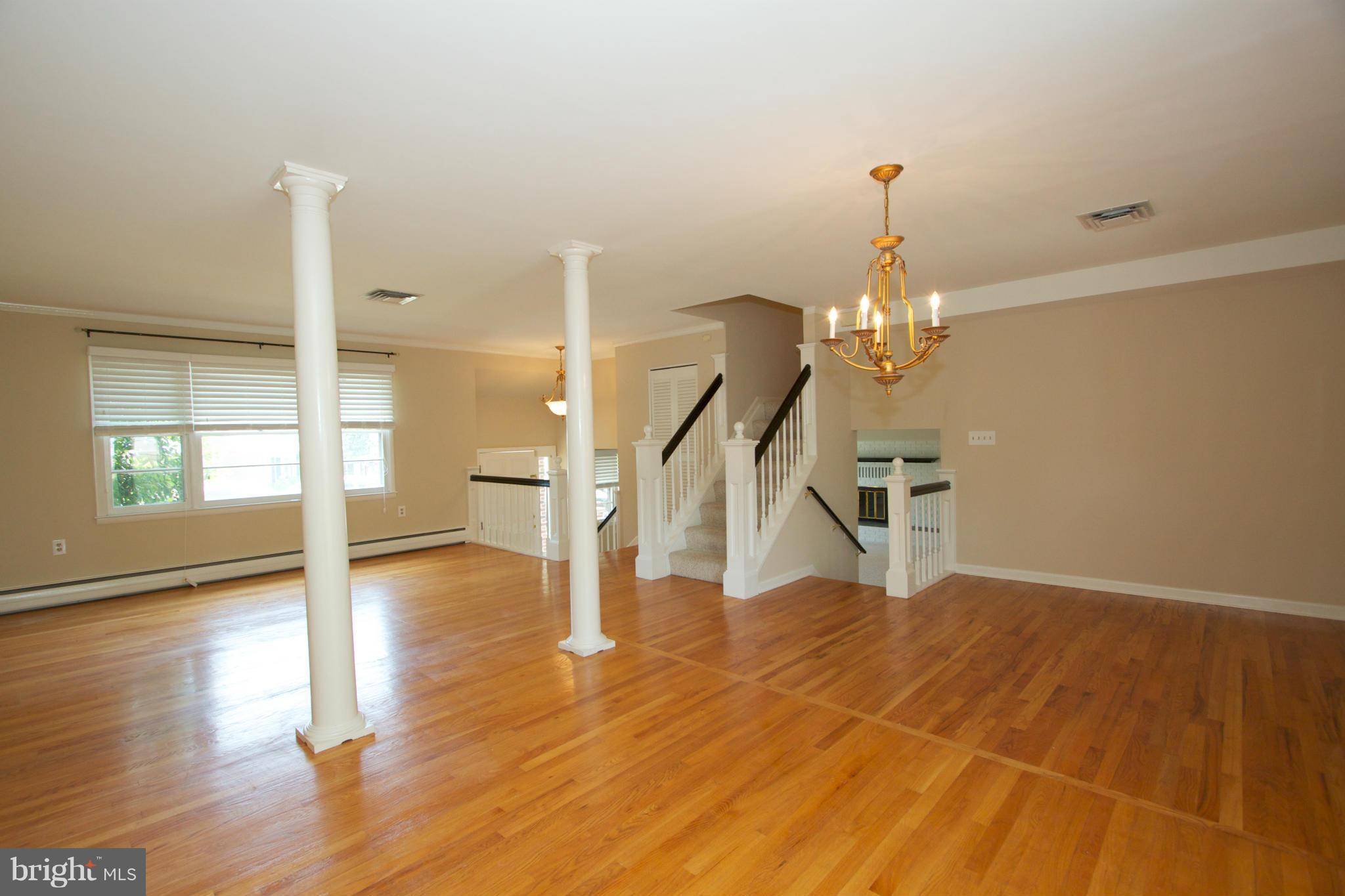 8438 Coco Road Baltimore, MD 21237 - Photo 13 of 29 a view of an entryway with wooden floor