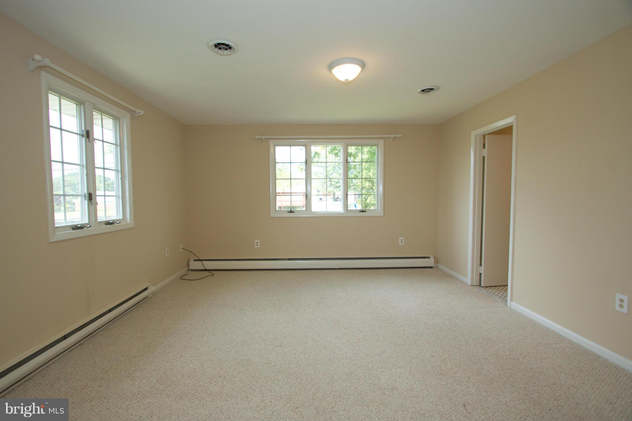 8438 Coco Road Baltimore, MD 21237 - Photo 16 of 29 an empty room with a window