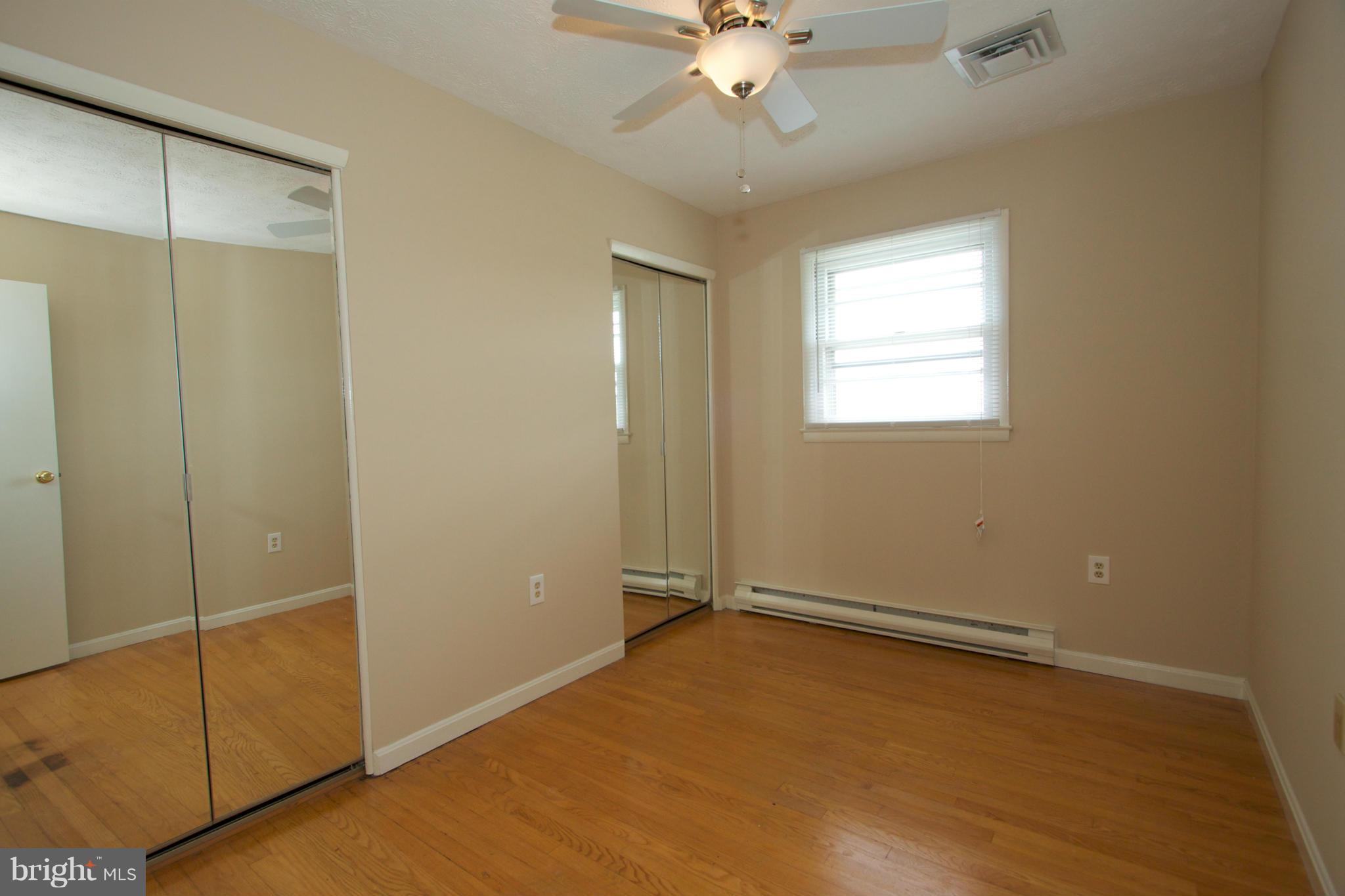 8438 Coco Road Baltimore, MD 21237 - Photo 19 of 29 a view of an empty room with a window