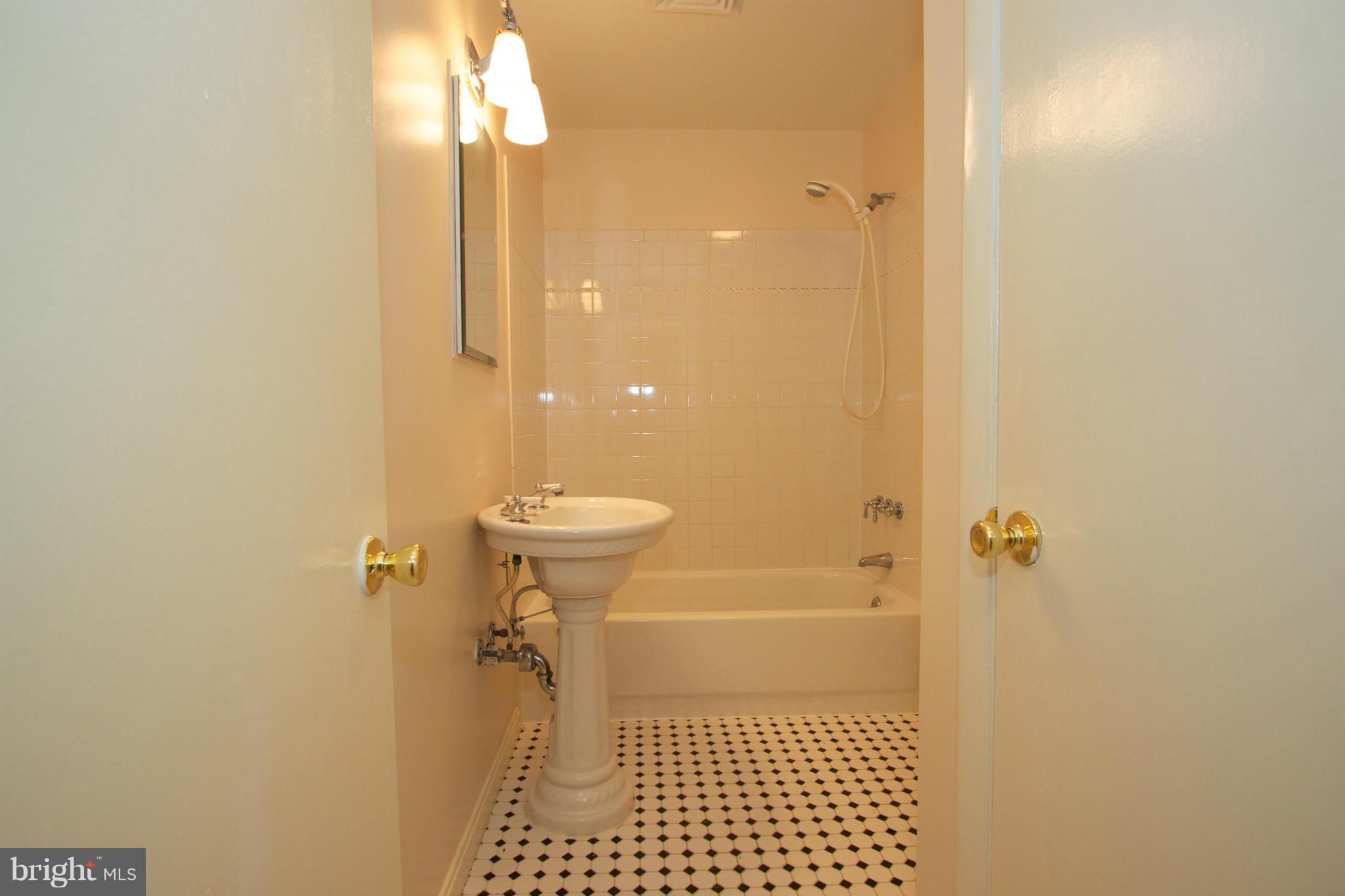 8438 Coco Road Baltimore, MD 21237 - Photo 20 of 29 a bathroom with a shower
