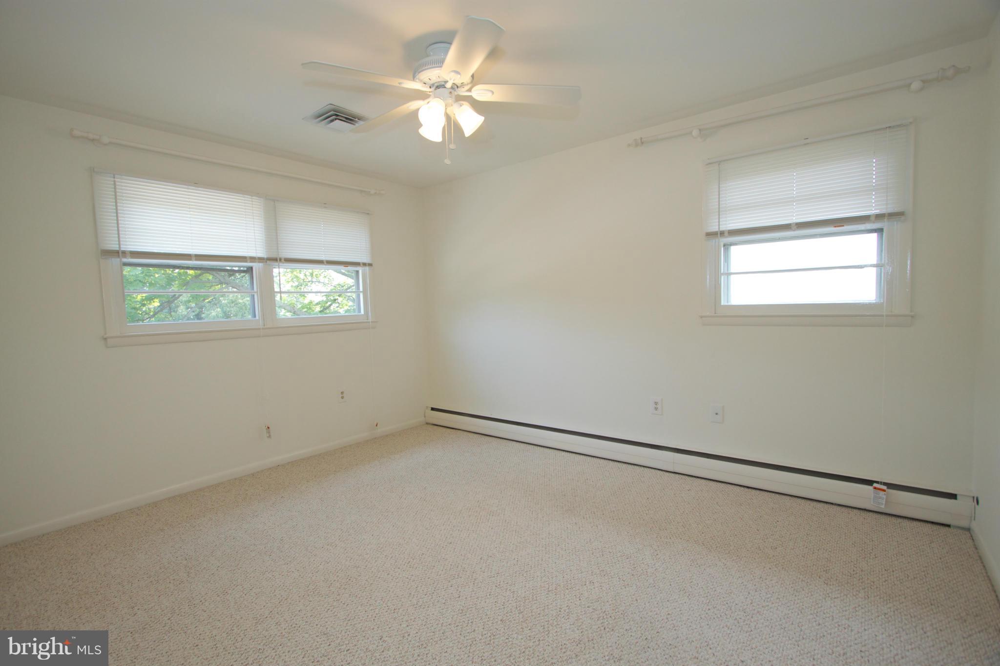 8438 Coco Road Baltimore, MD 21237 - Photo 21 of 29 an empty room with a window