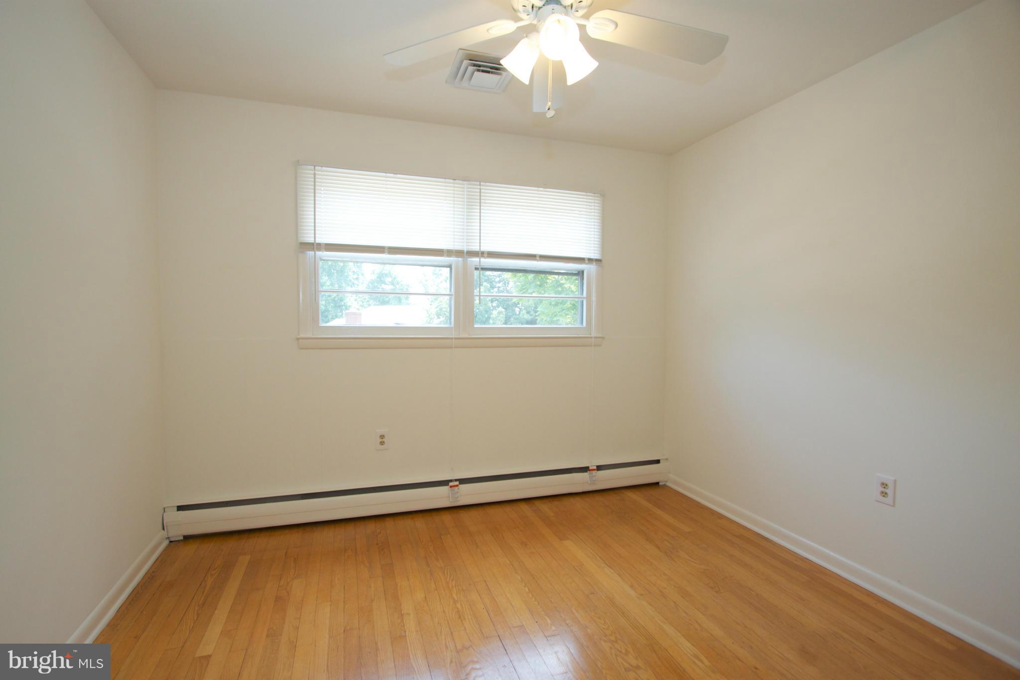 8438 Coco Road Baltimore, MD 21237 - Photo 22 of 29 an empty room with a window