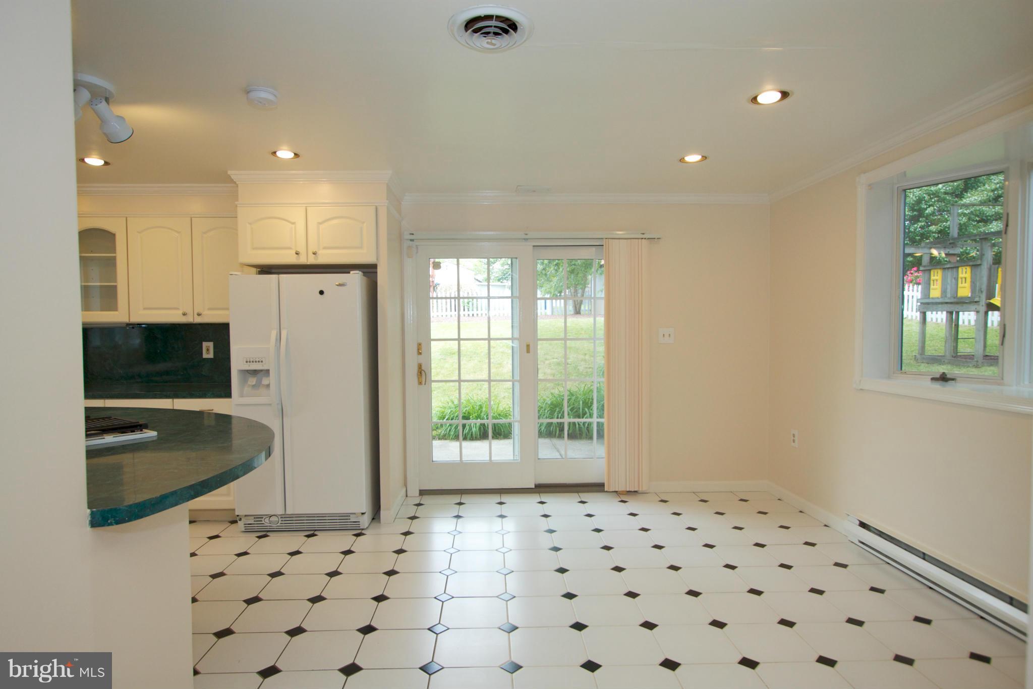 8438 Coco Road Baltimore, MD 21237 - Photo 6 of 29 a bathroom with a sink a large mirror and shower