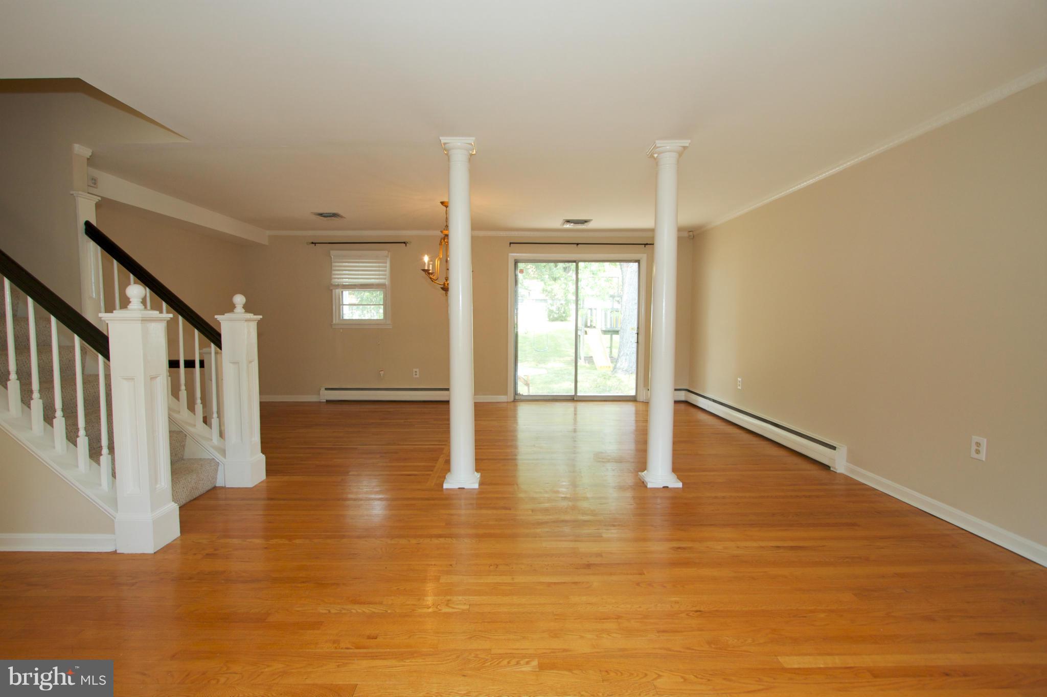 8438 Coco Road Baltimore, MD 21237 - Photo 10 of 29 a view of an entryway with wooden floor