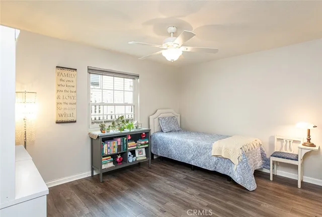 a bedroom with bed and a window