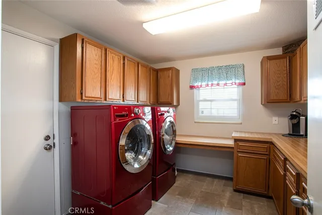 a utility room with closet dryer and washer