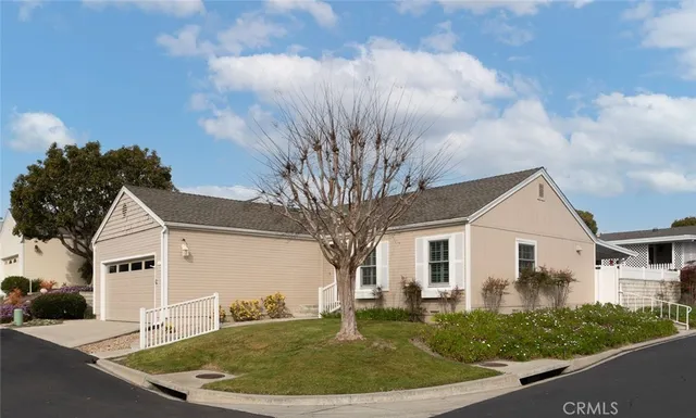 a front view of a house with swimming pool and porch